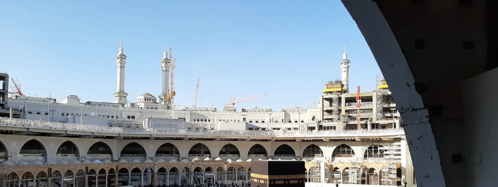 Muslim pilgrims circling the Kaaba during spiritual Umrah pilgrimage in Mecca